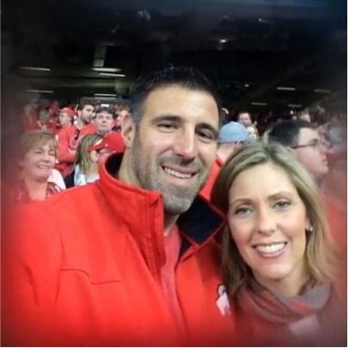 Jen Vrabel with spouse Mike Vrabel at a football game